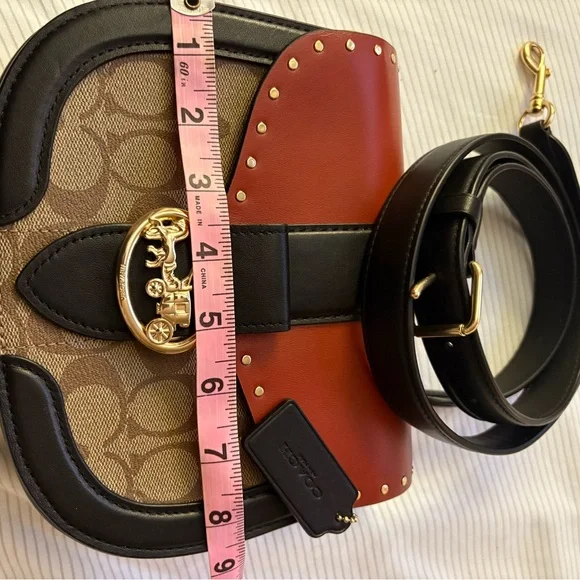 COACH Georgie Saddle Crossbody Bag colorblock signature canvas with rivets.